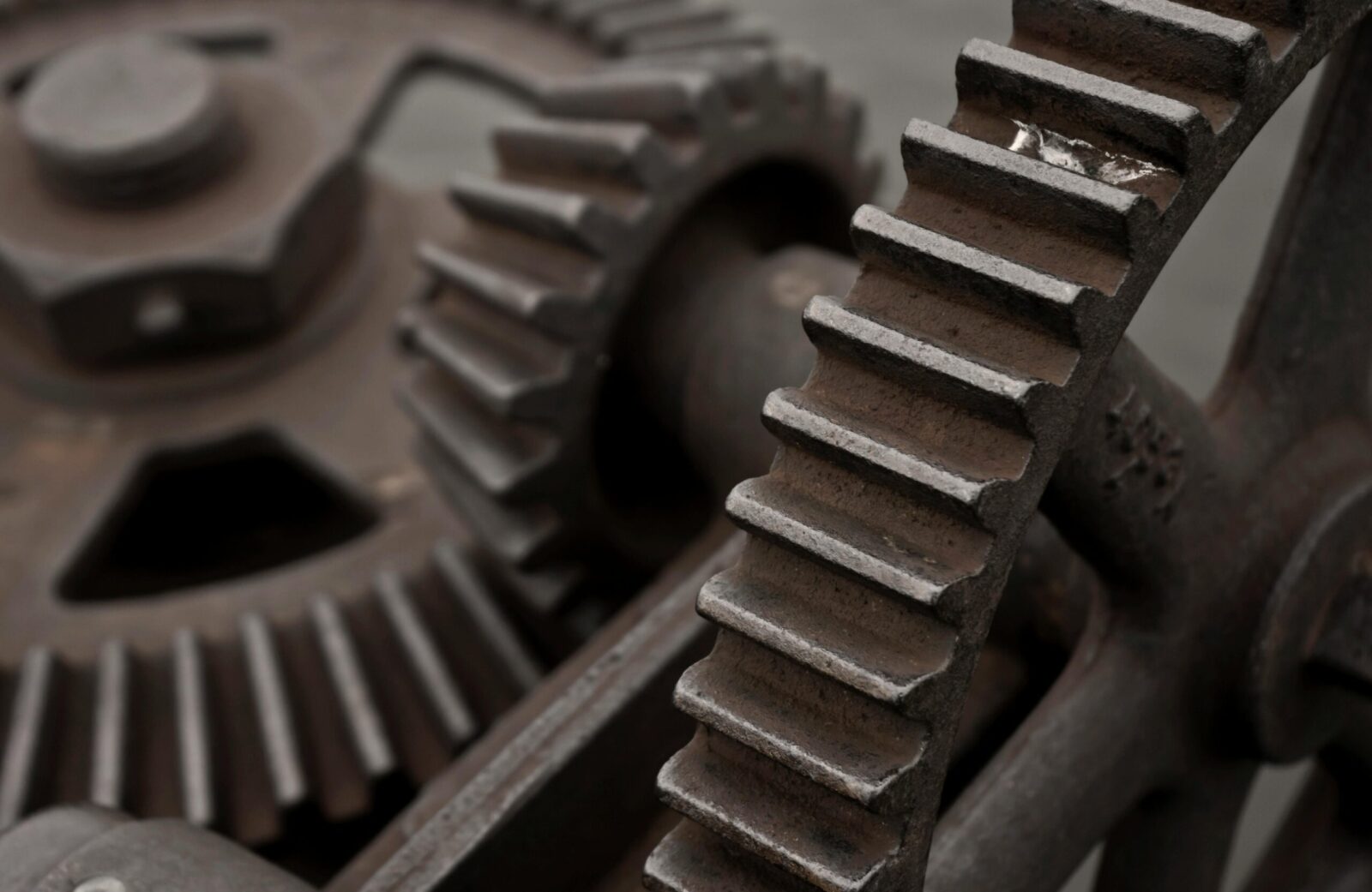 Detailed view of rusty gears showing intricate mechanism and texture. Perfect for industrial themes.